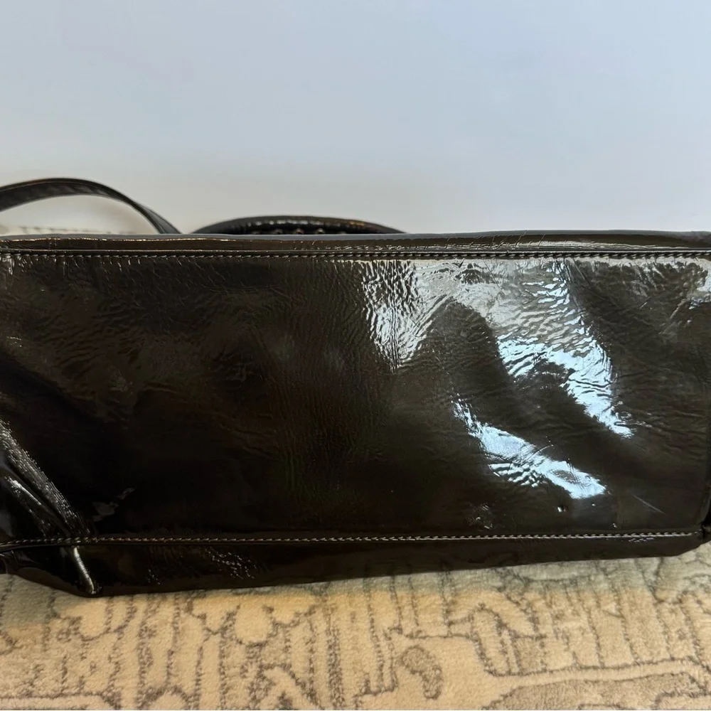 BEBE Large Handbag Leopard Grommet in Black and gray and gold